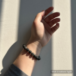 Personalized dark gray cat memorial bracelet with natural stone beads, a keepsake to remember your beloved pet.