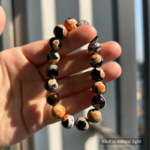 Personalized tortie cat memorial bracelet with natural stone beads, a keepsake to remember your beloved pet.