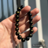 dog-pet-memorial-bracelet-black-003 Handmade with natural stone beads, reflecting your dog’s unique fur color. A heartfelt keepsake for grieving pet owners.