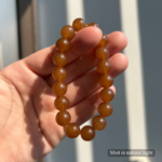 Personalized caramel cat memorial bracelet with natural stone beads, a keepsake to remember your beloved pet.