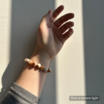 Personalized cream cat memorial bracelet with natural stone beads, a keepsake to remember your beloved pet.