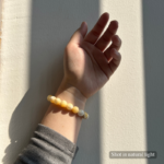 Personalized golden dog memorial bracelet with natural stone beads, a keepsake to remember your beloved pet.