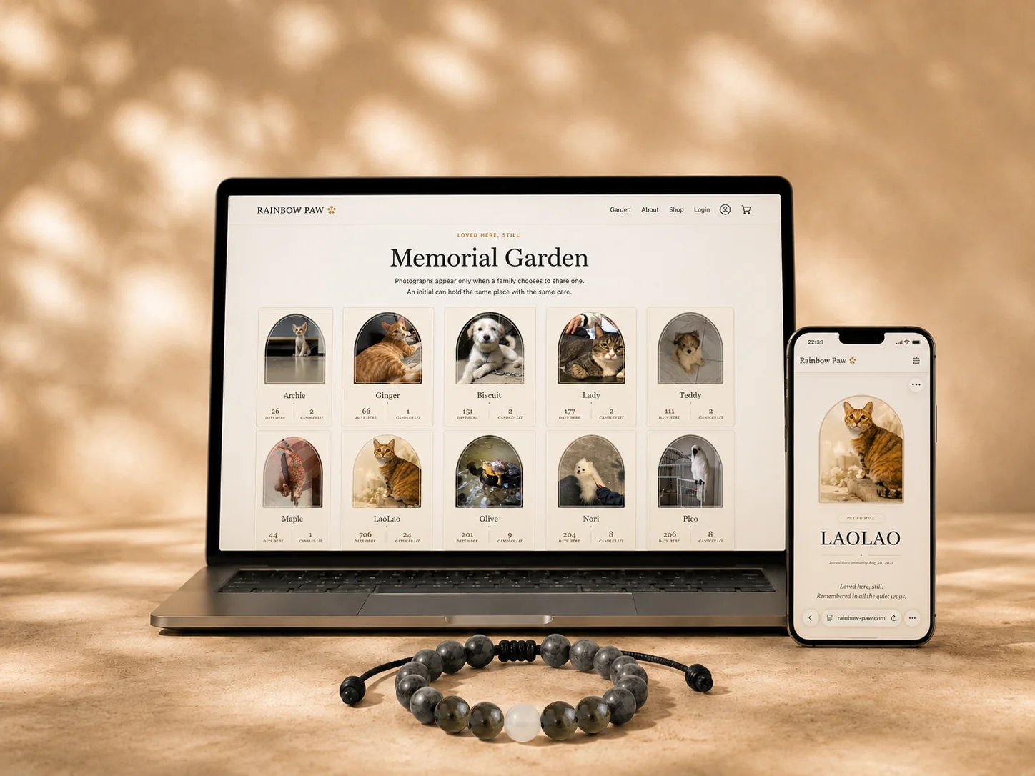 Rainbow Paw Memorial Garden displayed on a laptop and mobile phone