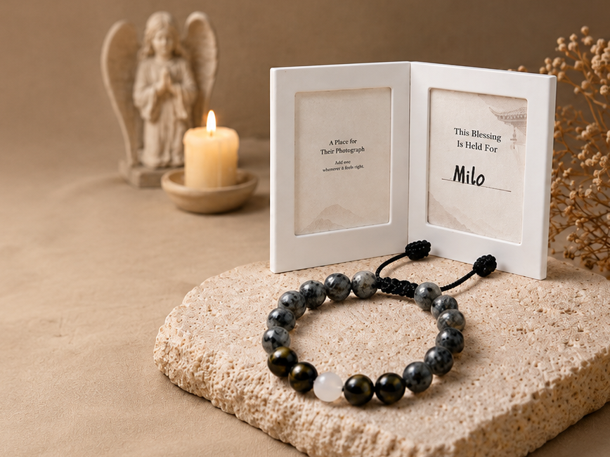 The Return Bracelet beside an optional pet memory frame and candle