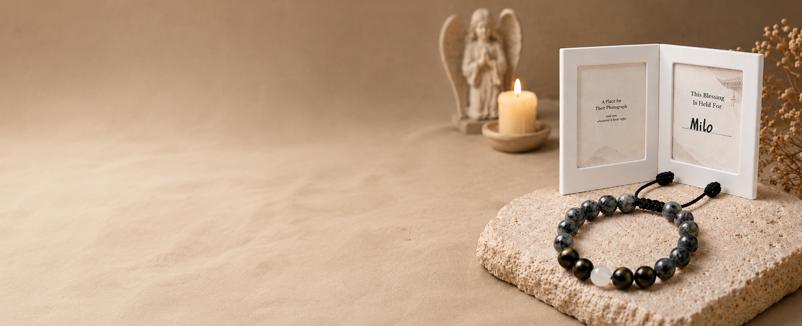 The Return Bracelet pet remembrance set beside an optional memory frame and candle